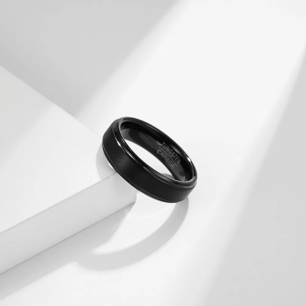 Tungsten modern black wedding ring design with stepped edges and a comfort fit interior.