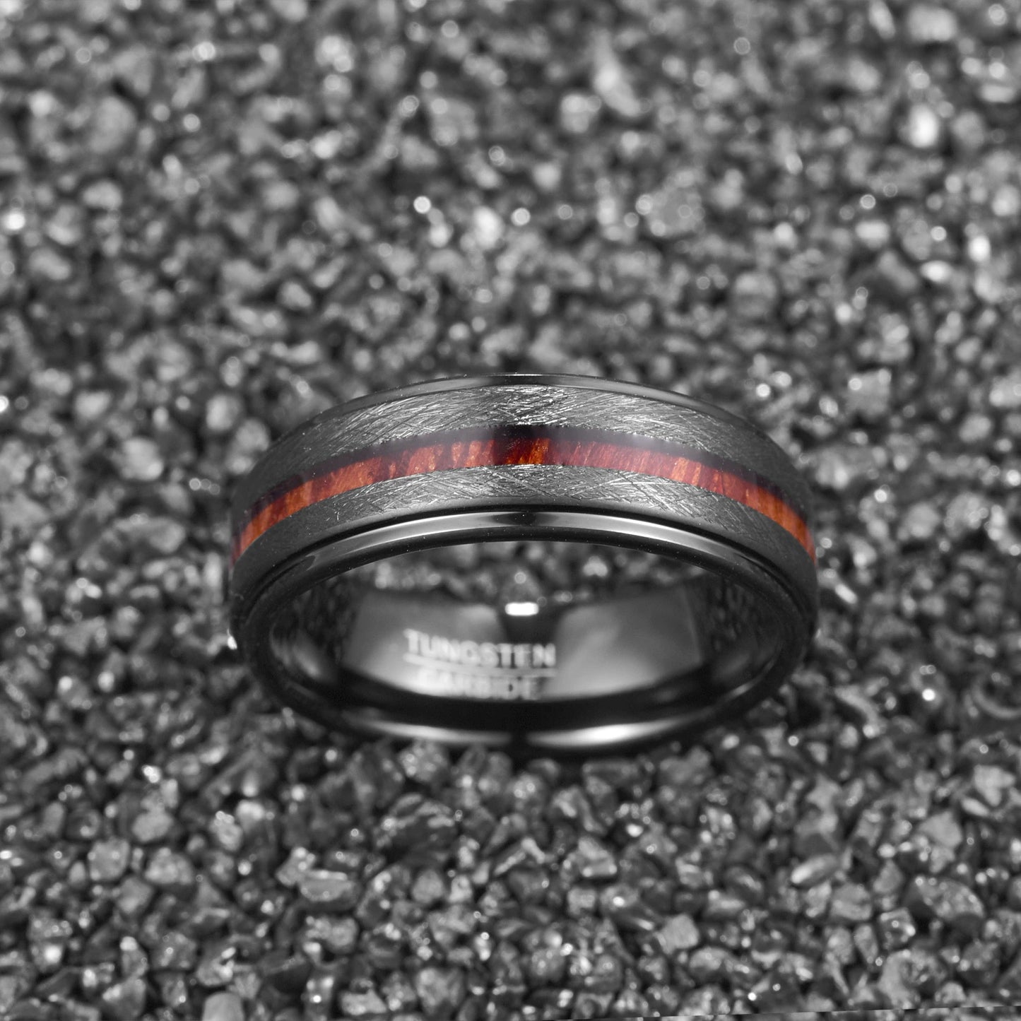 Black ring wedding band crafted from black Tungsten, with an 8mm width and stepped edges.
