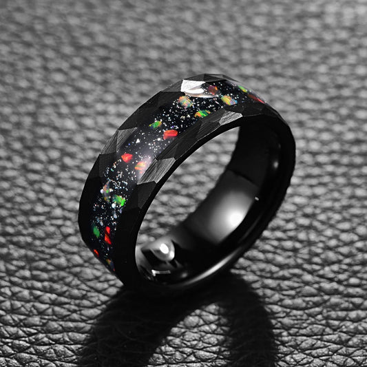 Fire red opal ring, featuring a domed black Tungsten band with vibrant opal chunks.