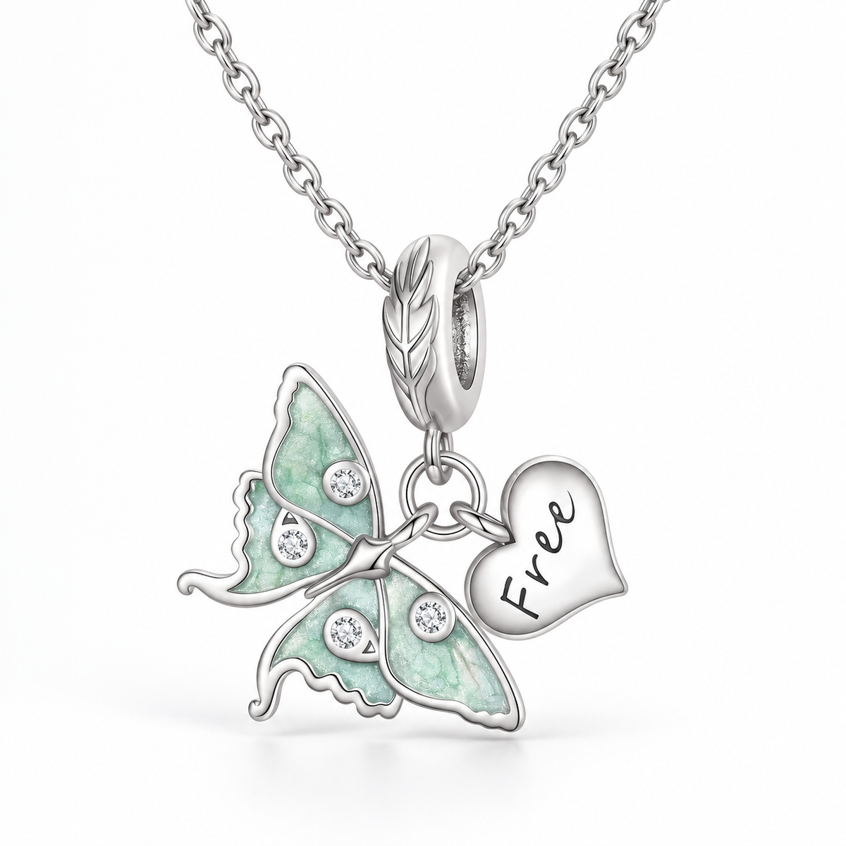 Matching necklace with beautiful moth and dangling heart charm.