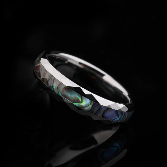 Nature inspired wedding rings with polished white gold Tungsten, abalone shell inlay, and faceted edges.
