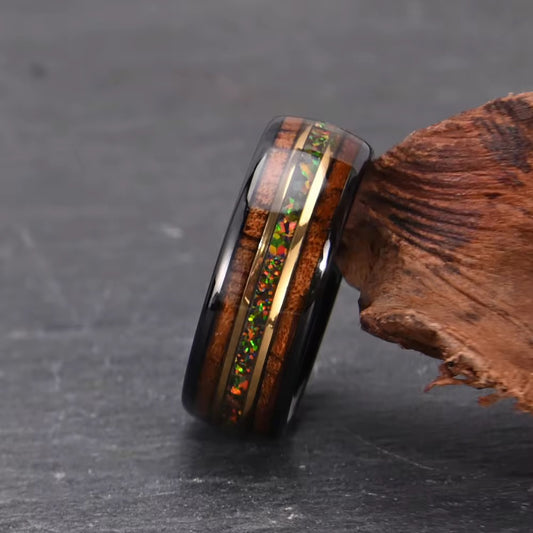 Opal jewelry for men, in the form of a Tungsten band with opal inlay.