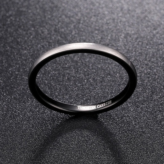 Silver and black rings, featuring a narrow feminine domed design.