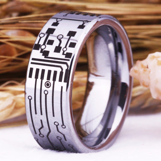 Best gifts for techies featuring a silver Tungsten men’s ring with engraved circuitry.
