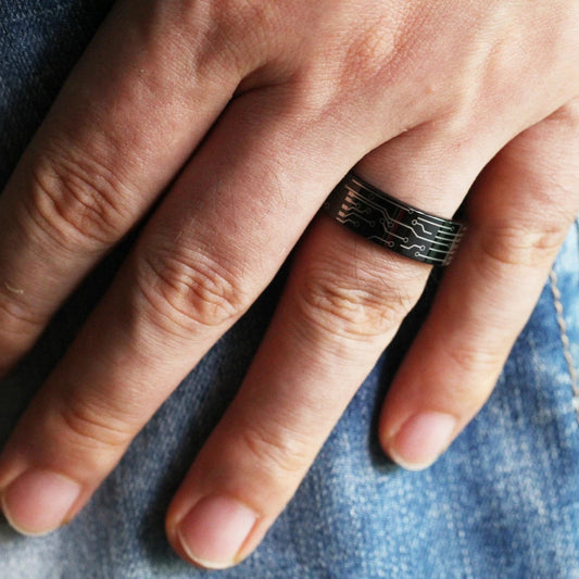 Circuit board ring in black Tungsten with permanently engraved circuitry.