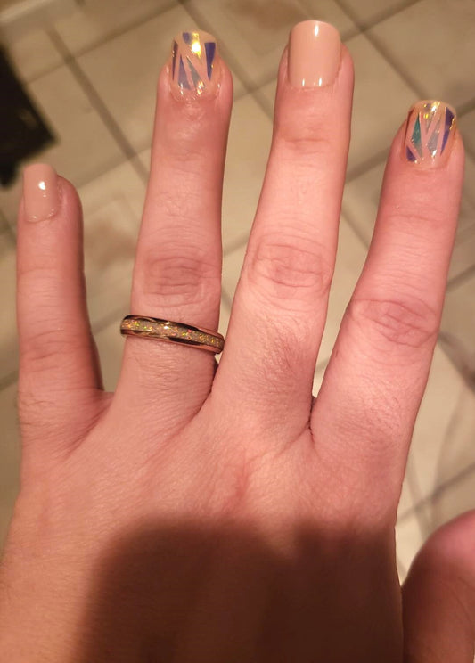 Opal ring womens range in rose gold Tungsten with fire opal inlay, worn on finger.