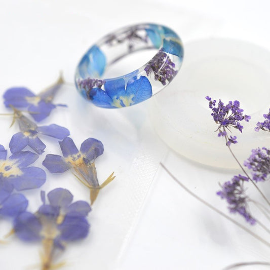Real flower rings featuring genuine wildflowers suspended in resin.