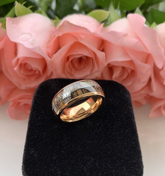 Rose gold Tungsten men's ring featuring a real wood inlay of Zebrawood and genuine deer antler, accented with a silver arrow design on a domed band.