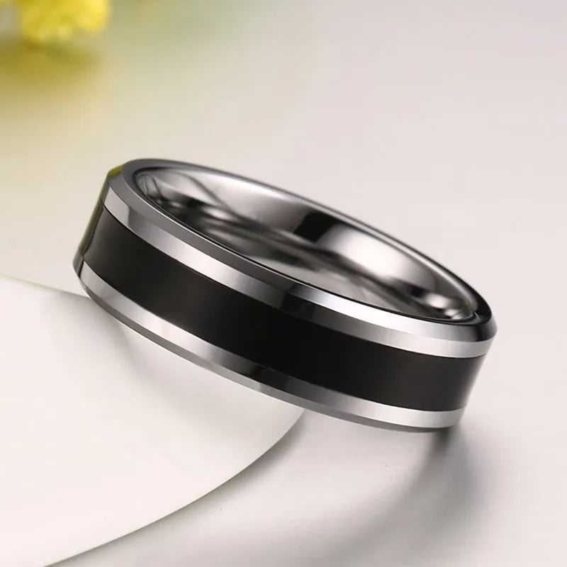 Side angle view of a 6mm black Tungsten ring showcasing the sleek silver edges and bold black center stripe.