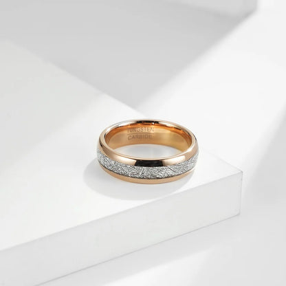 6mm rose gold Tungsten men's wedding band with meteorite inlay, photographed on a white surface.