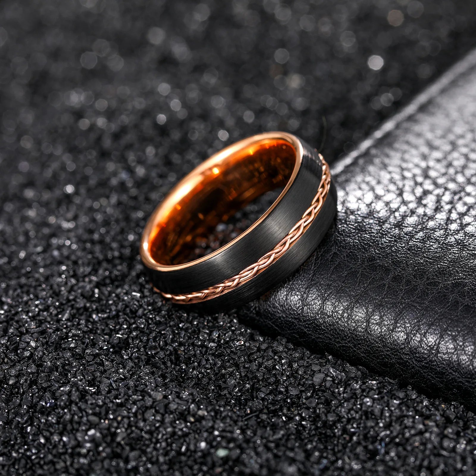 8mm brushed black Tungsten ring with rose gold braided wire and polished rose gold interior, domed band