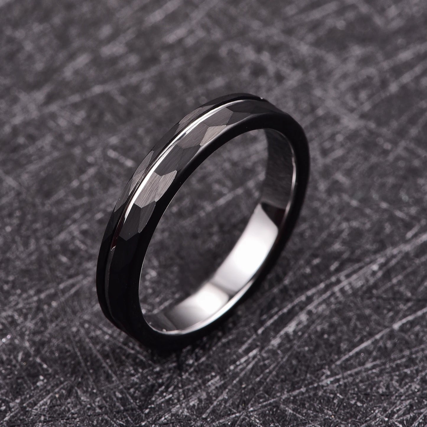 4mm men's ring with a black Tungsten hammered exterior and smooth polished silver Tungsten interior, offering a modern dual-tone look.