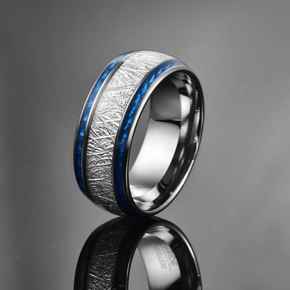 Silver Tungsten ring with a meteorite and blue carbon fiber inlay, displayed against a black background.