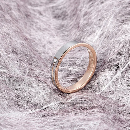 Elegant silver and rose gold Tungsten ring featuring a sleek design with a small diamond accent, perfect as a women's engagement or promise ring.