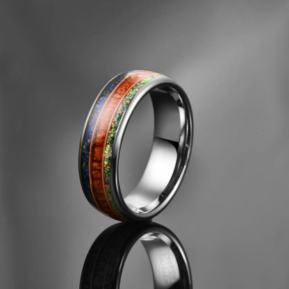 Men's 8mm silver Tungsten ring with a domed band, featuring inlays of crushed opal, lapis lazuli, and acacia wood, separated by rose gold guitar strings.