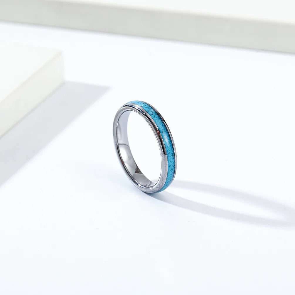 Silver Tungsten 4mm wedding ring with turquoise inlay displayed on a minimalistic surface