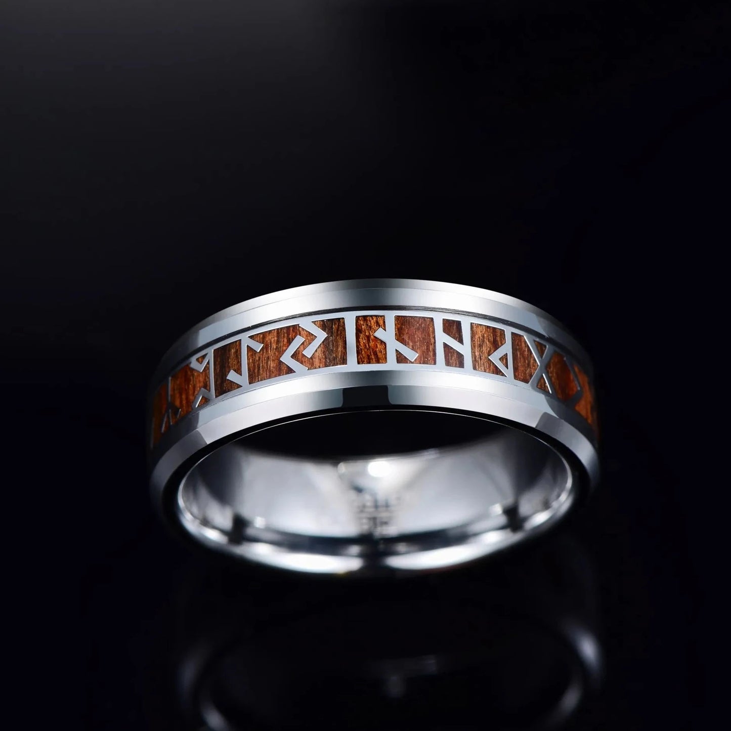 Viking Rune ring with silver and wood inlay against a black background