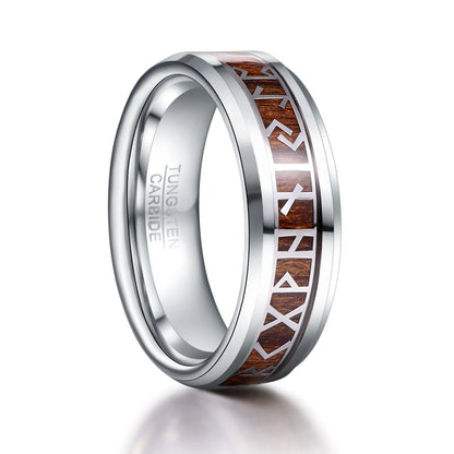 Close-up of a Viking Rune ring in silver with wood inlay on a white background