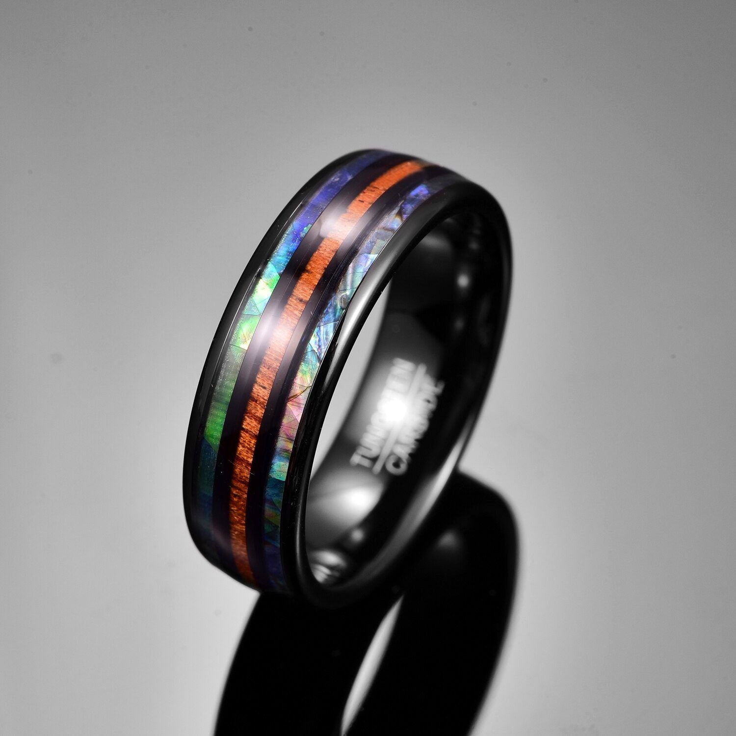 Abalone shell jewelry in the form of a Tungsten ring.