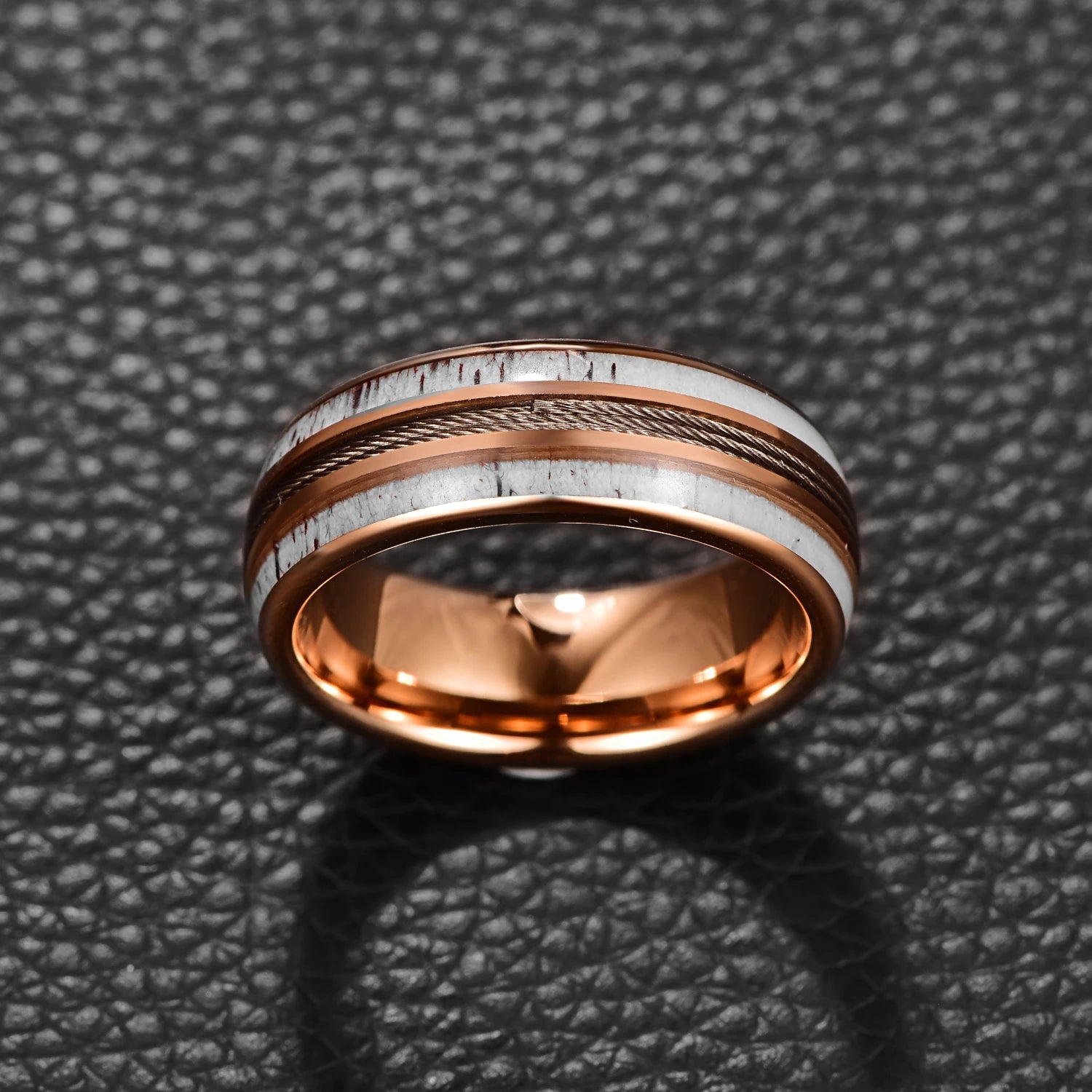 Antler rings for men featuring a rose gold Tungsten band with guitar strings and deer antler.