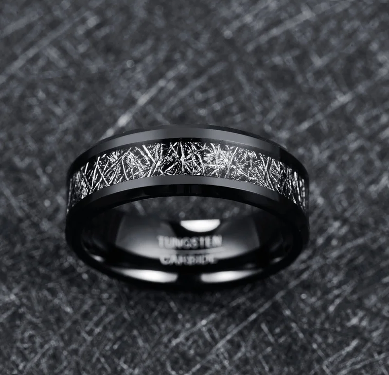 Black meteorite ring featuring an 8mm Tungsten band inlaid with Gibeon meteorite.