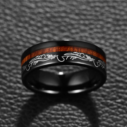 Black Tungsten ring with filigree feather detailing and offset acacia wood inlay, front view