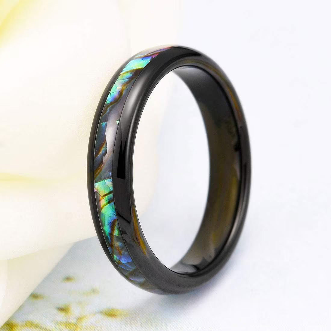 Black Tungsten ring featuring a shimmering abalone shell inlay with ocean-inspired hues.