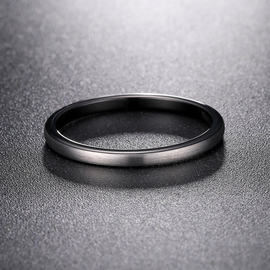 Black and silver wedding rings, with a domed band in 2mm width.