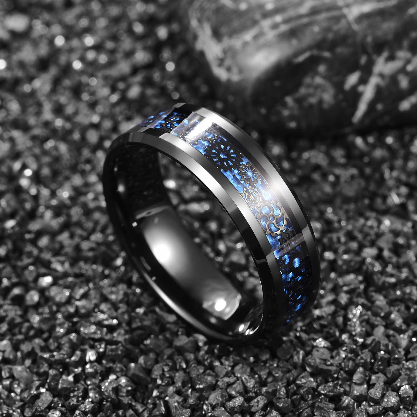 Gear ring jewelry featuring a gear inlay over blue carbon fiber.