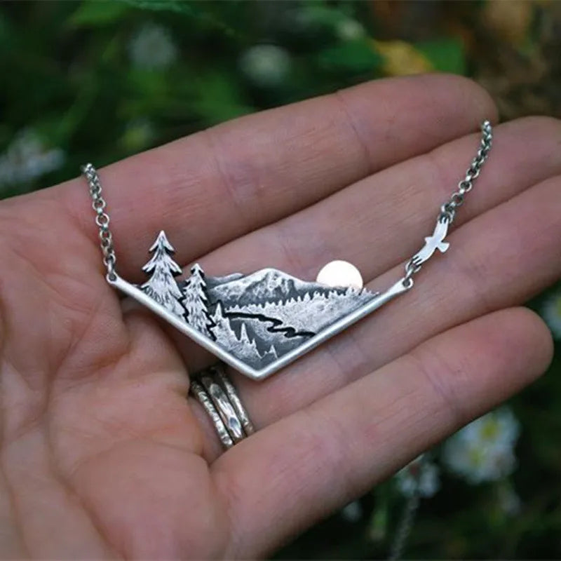Gifts for female hikers, featuring a wilderness pendant with mountains.