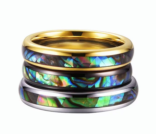 Set of gold, rose gold, and silver Tungsten rings featuring vibrant abalone shell inlays.