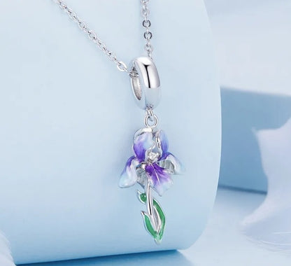 Iris necklace in 925 sterling silver with a purple and white flower pendant and green enamel leaves.