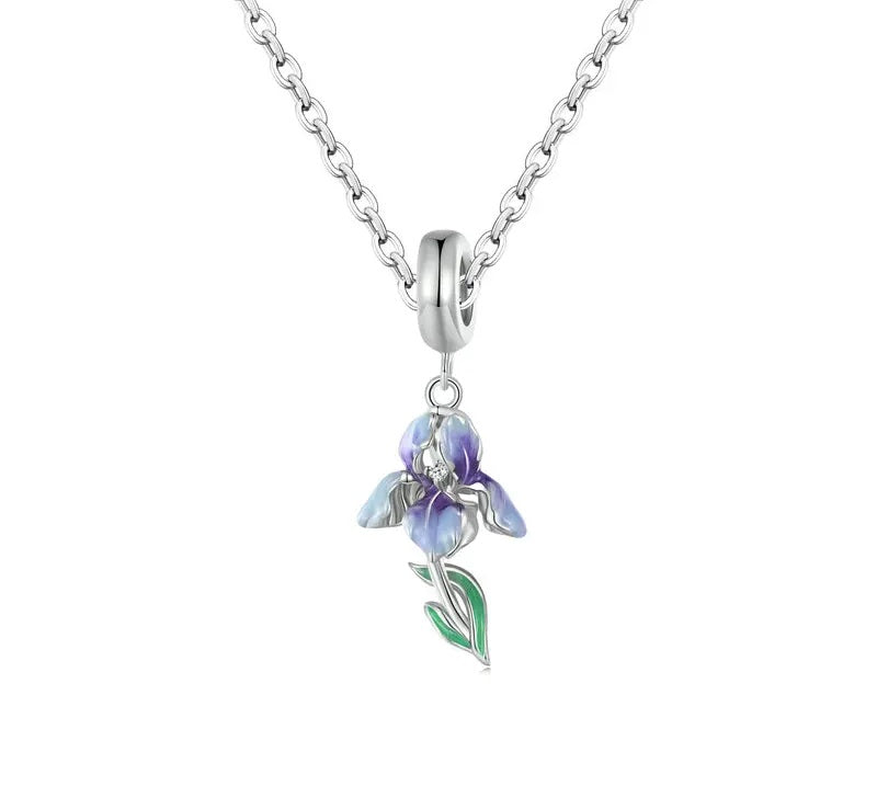 Iris pendant with delicate purple petals, sterling silver details, and a slender green stem.