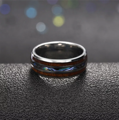 Koa rings crafted with silver Tungsten and abalone shell inlay.