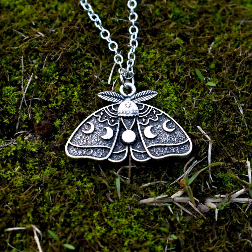 Luna moth crescent moon necklace with an antiqued silver finish and intricate lunar symbolism.