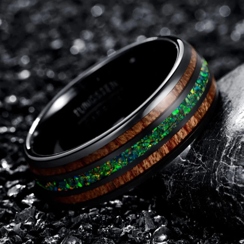 Angled view of a men's tungsten ring with acacia wood and green opal inlay, highlighting the vibrant opal and wood combination.