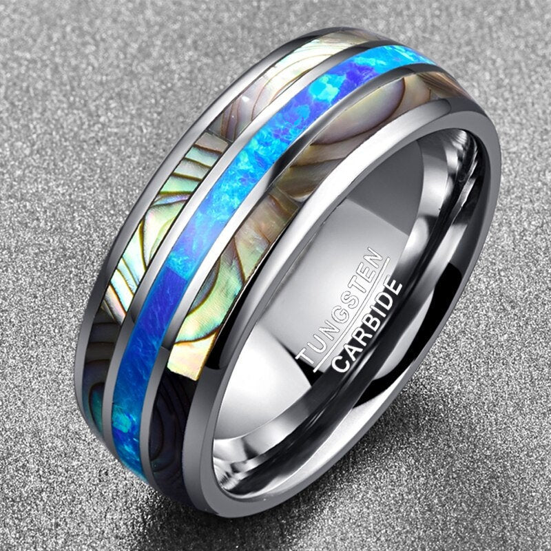 Mens wedding rings with gemstones featuring a vibrant opal and abalone inlay.