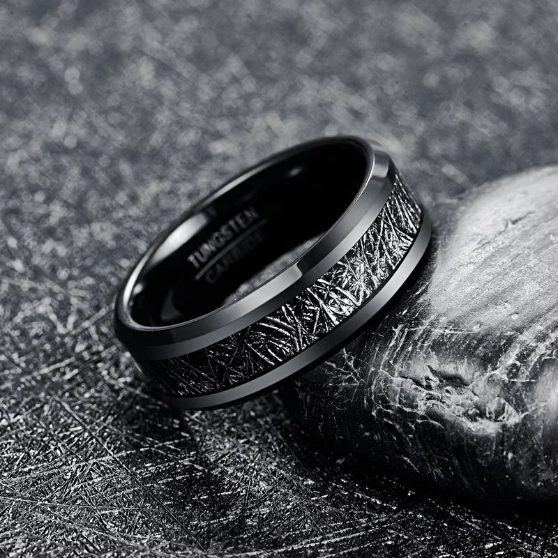 Meteorite ring with a black Tungsten band and authentic Gibeon meteorite inlay.