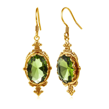 Peridot and gold earrings, featuring faceted oval green gemstones in ornate vintage-inspired settings.