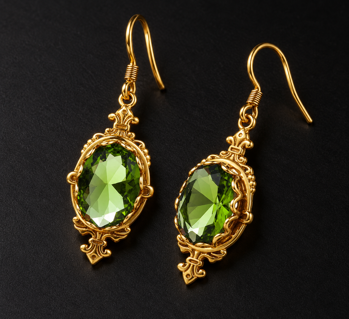 Peridot gold drop earrings with vivid green gemstones framed by warm yellow gold detailing.