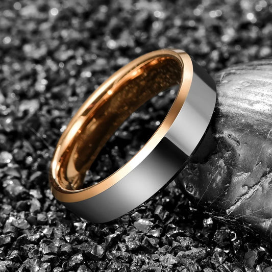 Polished silver and rose gold Tungsten ring featuring beveled edges