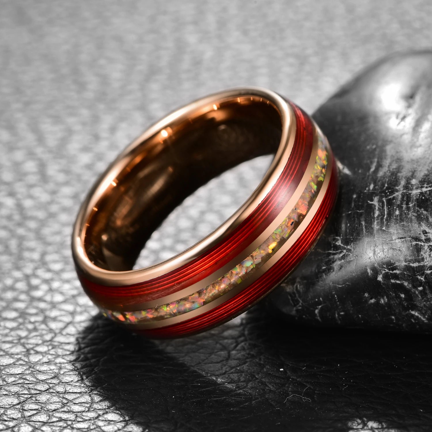 Side view of 8mm rose gold Tungsten men’s ring with red guitar string and white fire opal inlay