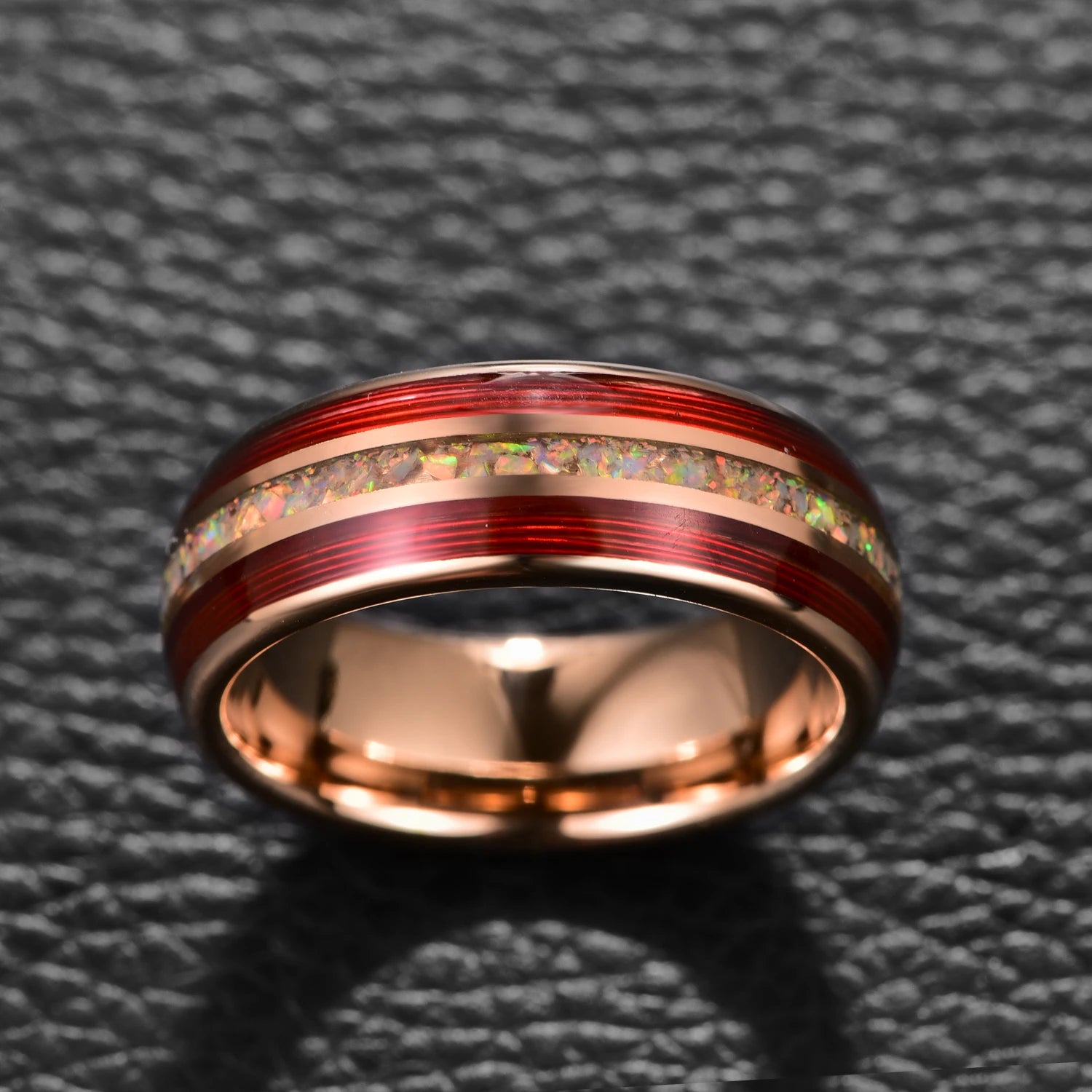 Top view of 8mm rose gold Tungsten men’s ring with red guitar string and white fire opal inlay