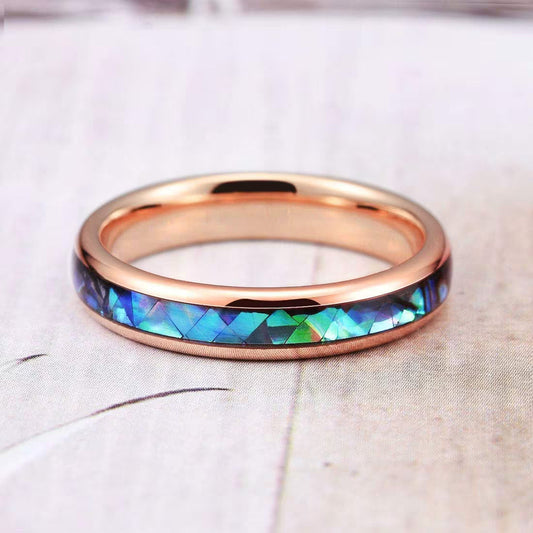 Rose gold Tungsten ring with an iridescent abalone shell inlay highlighting oceanic colors.