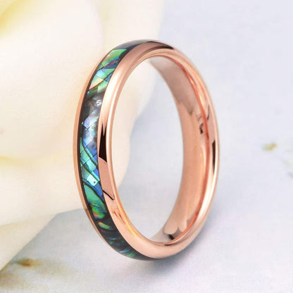 Rose gold Tungsten ring with a colorful abalone shell inlay, reflecting vibrant ocean colors.