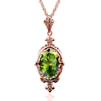Rose gold peridot necklace with a faceted oval green gemstone in a warm vintage-inspired pendant setting.