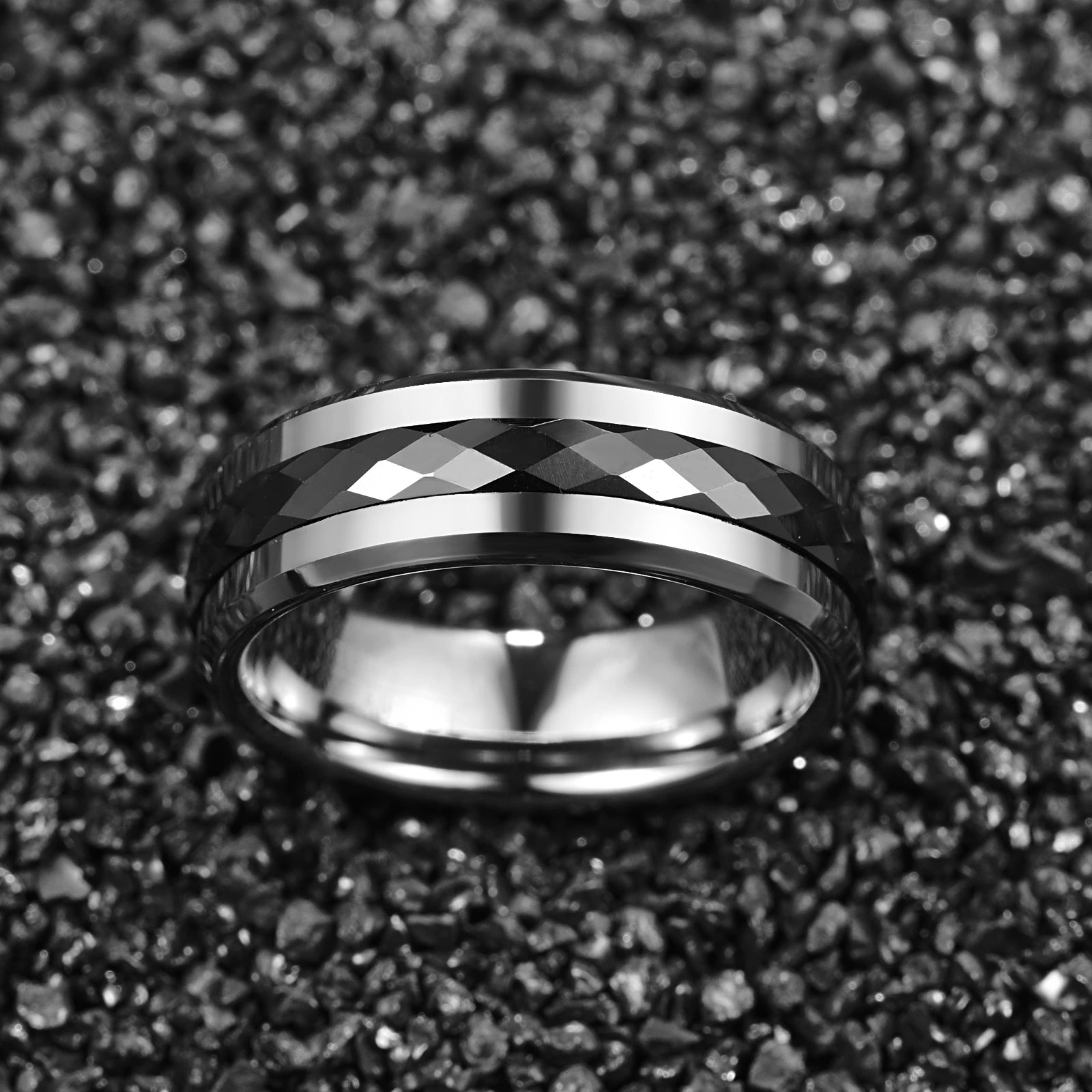 Silver and black tungsten spinner ring with faceted design, 8mm width.