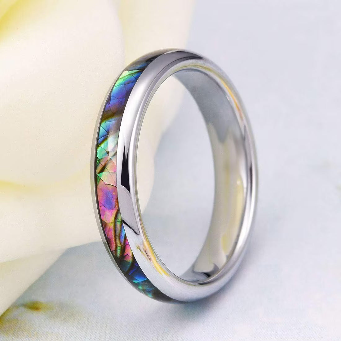 Silver Tungsten ring showcasing a radiant abalone shell inlay, with iridescent blues and greens.