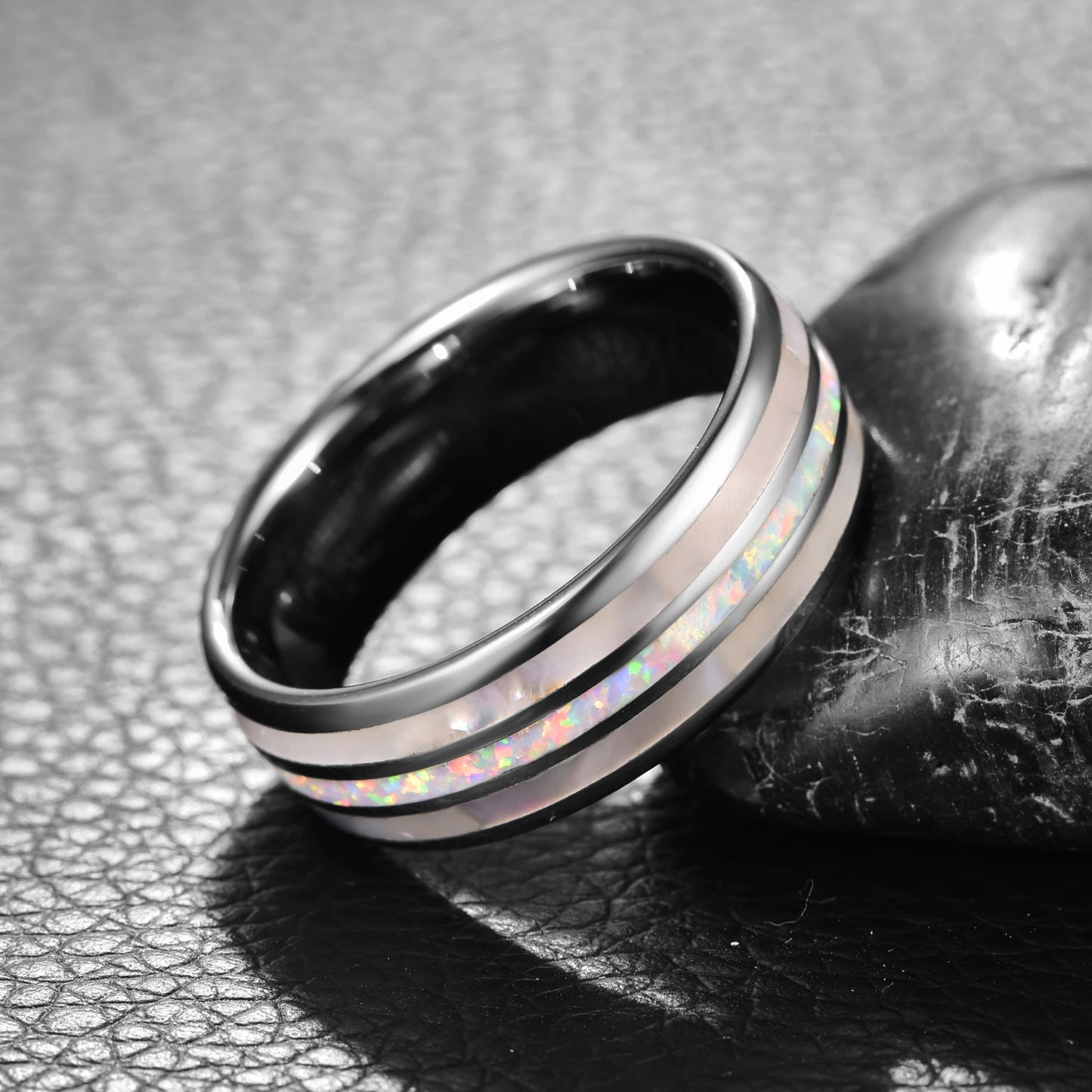 Silver Tungsten ring with white fire opal center and mother of pearl inlay, angled view