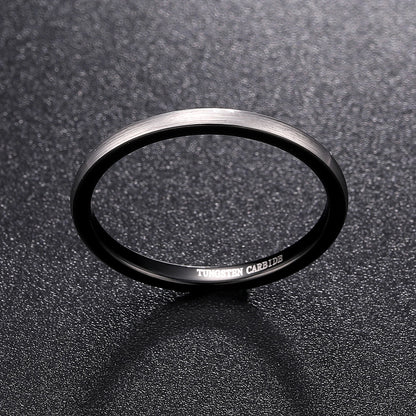 Silver and black rings, featuring a narrow feminine domed design.